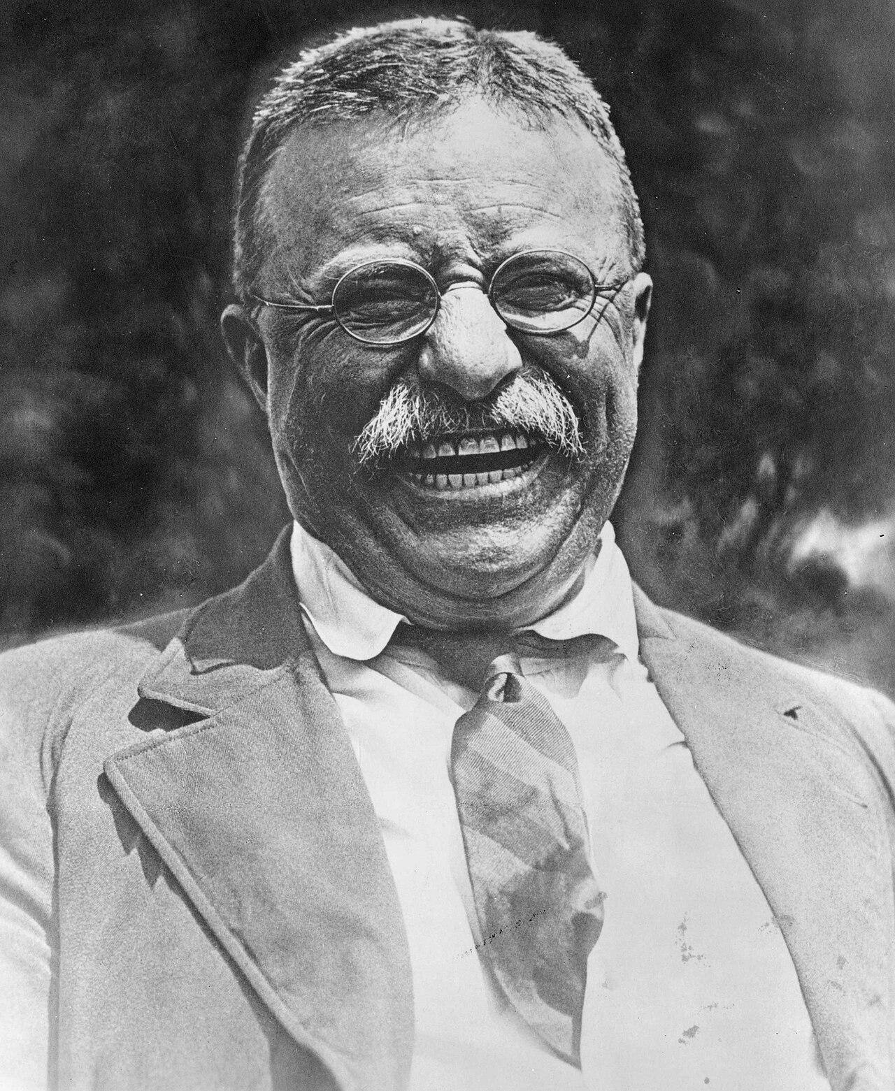 Theodore Roosevelt laughing in an archival photograph